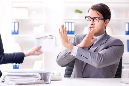 Businessmanbeing offered bribe for breaking lawの写真素材