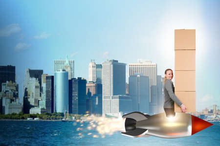 Woman flying rocket and delivering boxesの写真素材