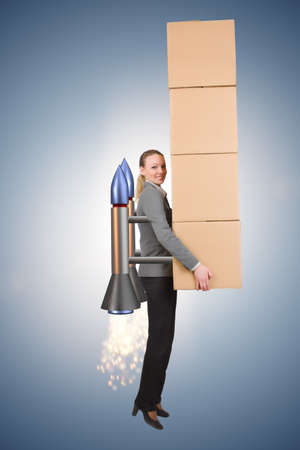 Woman in fast box delivery service on rocketの写真素材