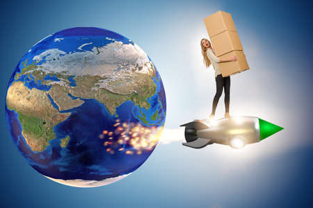 Woman flying jetpack and delivering boxes globallyの写真素材