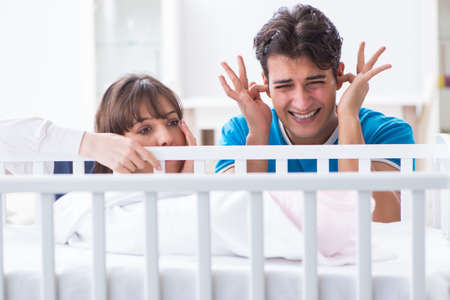 Young family frustrated at baby cryingの写真素材