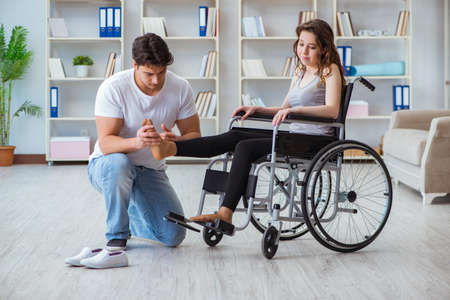 Patient undergoing rehabilitation recovery programme with doctor