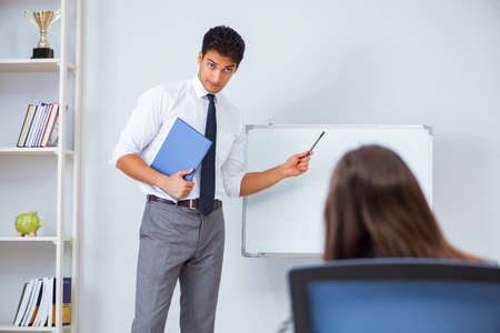Business presentation in the office with man and womanの写真素材