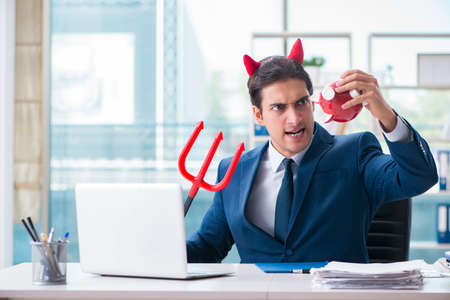 Devil angry businessman in the officeの写真素材