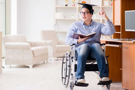 Disabled student studying at home on wheelchairの写真素材