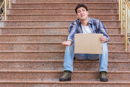 Young man begging money on the street