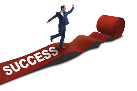 Businessman on red carpet isolated white backgroundの写真素材