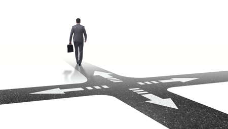 Young businessman at crossroads in uncertainty conceptの写真素材
