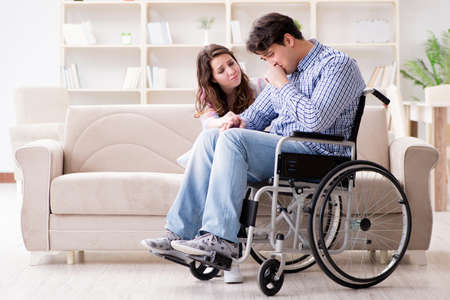 Desperate disabled person on wheelchairの写真素材