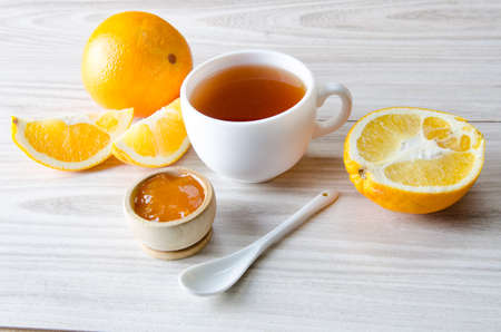 Cup of tea served with orange jamの写真素材