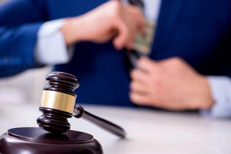 Lawyer receiving money as bribeの写真素材