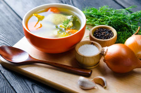 Fish soup served on the table in plateの写真素材