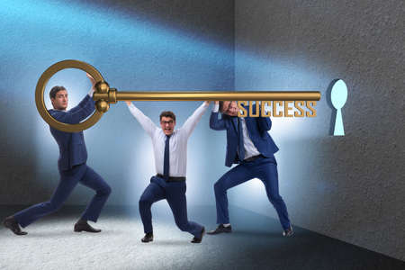 Businessmen in business success concept with keyの写真素材