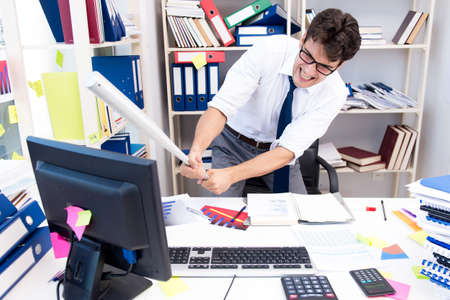 Busy frustrated businessman angry in the officeの写真素材