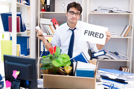 Employee being fired from work made redundantの写真素材