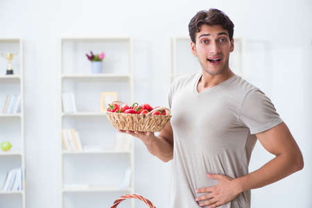 Young man in healthy eating and dieting conceptの写真素材