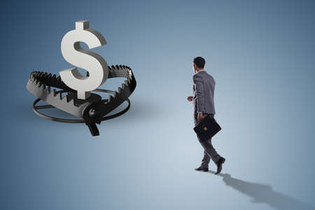 Businessman being trapped by dollarの写真素材