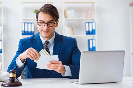 Lawyer receiving money as bribeの写真素材