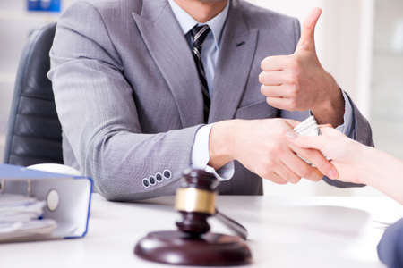 Lawyer being offered bribe for his servicesの写真素材