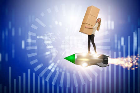Woman flying jetpack and delivering boxes globallyの写真素材
