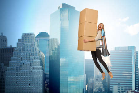 Woman in fast box delivery service on rocketの写真素材