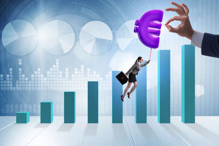 Businesswoman flying on euro sign inflatable balloonの写真素材