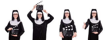 Young nun with clapperboard isolated on whiteの写真素材