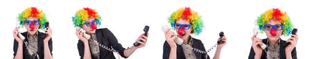 Businessman with clown wig isolated on whiteの写真素材