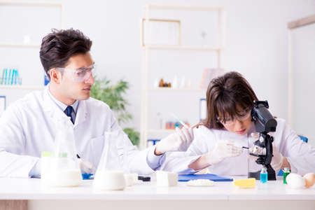 Two lab doctor testing food productsの写真素材