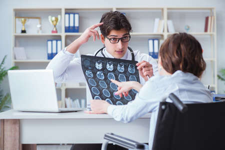 Doctor explaining to patient results of x-ray imagingの写真素材