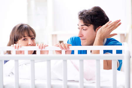Young family frustrated at baby cryingの写真素材