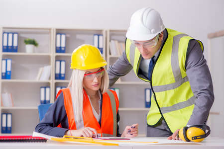 Construction workers having discussion in office before starting