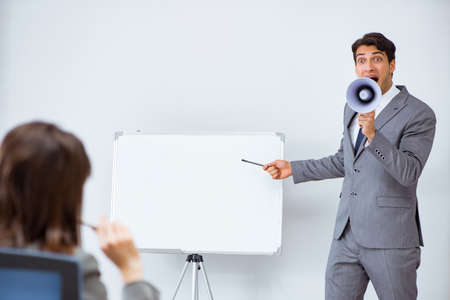 Business presentation in the office with man and womanの写真素材