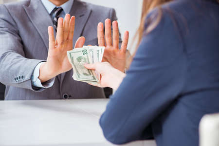 Businessmanbeing offered bribe for breaking lawの写真素材