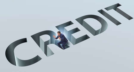 Businessman falling into trap of borrowing debt and creditの写真素材