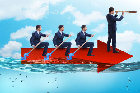 Teamwork concept with businessmen on boatの写真素材
