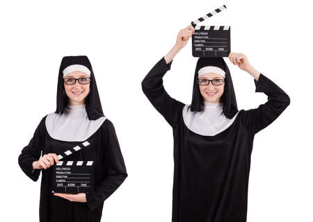 Young nun with clapperboard isolated on whiteの写真素材