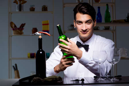 Professional sommelier tasting wine in restaurantの写真素材