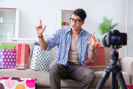 Male fashion blogger recording video for vlogの写真素材