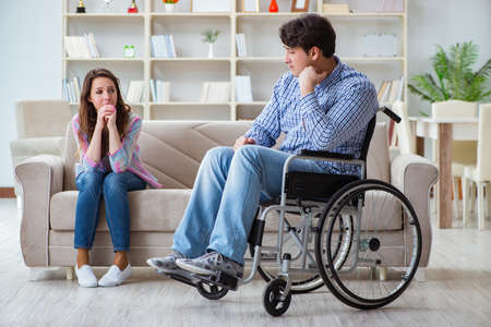 Desperate disabled person on wheelchairの写真素材