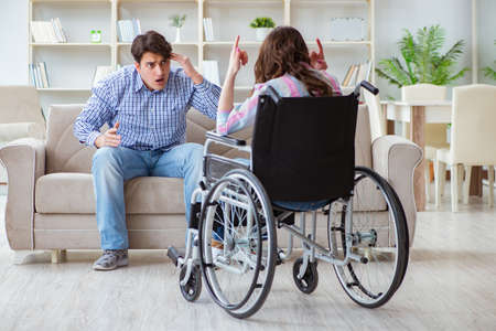 Desperate disabled person on wheelchairの写真素材