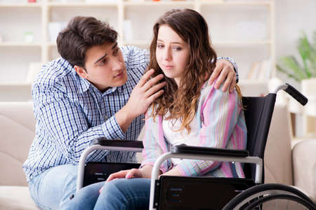 Desperate disabled person on wheelchairの写真素材