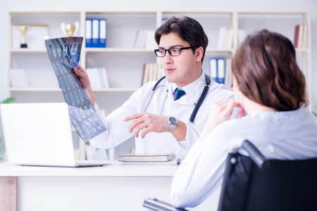Doctor explaining to patient results of x-ray imagingの写真素材