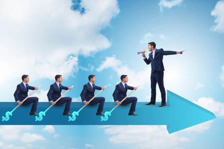 Team of businessmen in teamwork concept with boatの写真素材