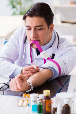 Doctor drug addict in the hospitalの写真素材