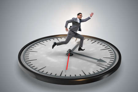 Businessman in time management conceptの写真素材