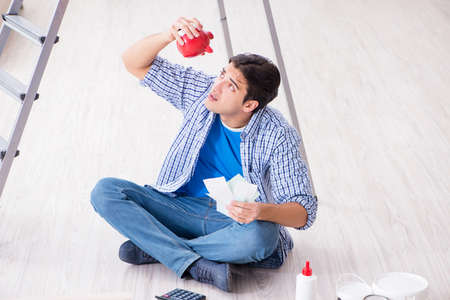 Young man overspending his budget in refurbishment projectの写真素材