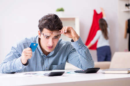 Young couple looking at family finance papers