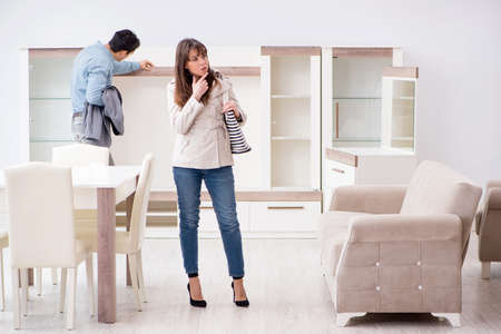 Married couple in the shop choosing furnitureの写真素材