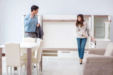 Married couple in the shop choosing furnitureの写真素材